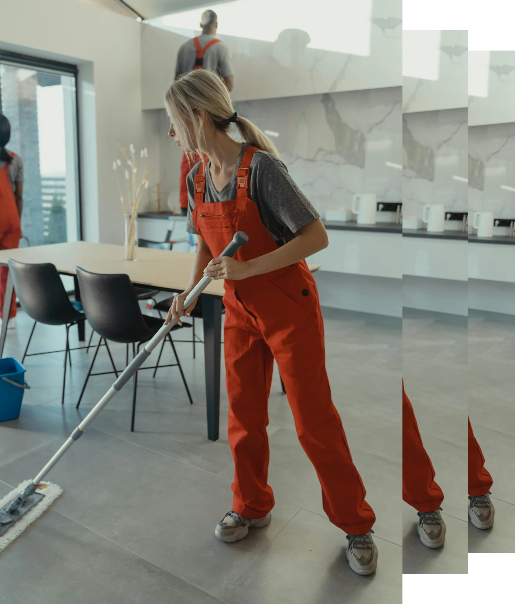 Discover Nesley Cleaning in action! This image captures our dedicated team of three professional cleaners meticulously working to leave your space spotless. Dressed in vibrant orange uniforms, one team member focuses on mopping the floor for a streak-free shine, while the others ensure every detail is handled. Trust Nesley Cleaning for top-quality commercial and residential cleaning services!